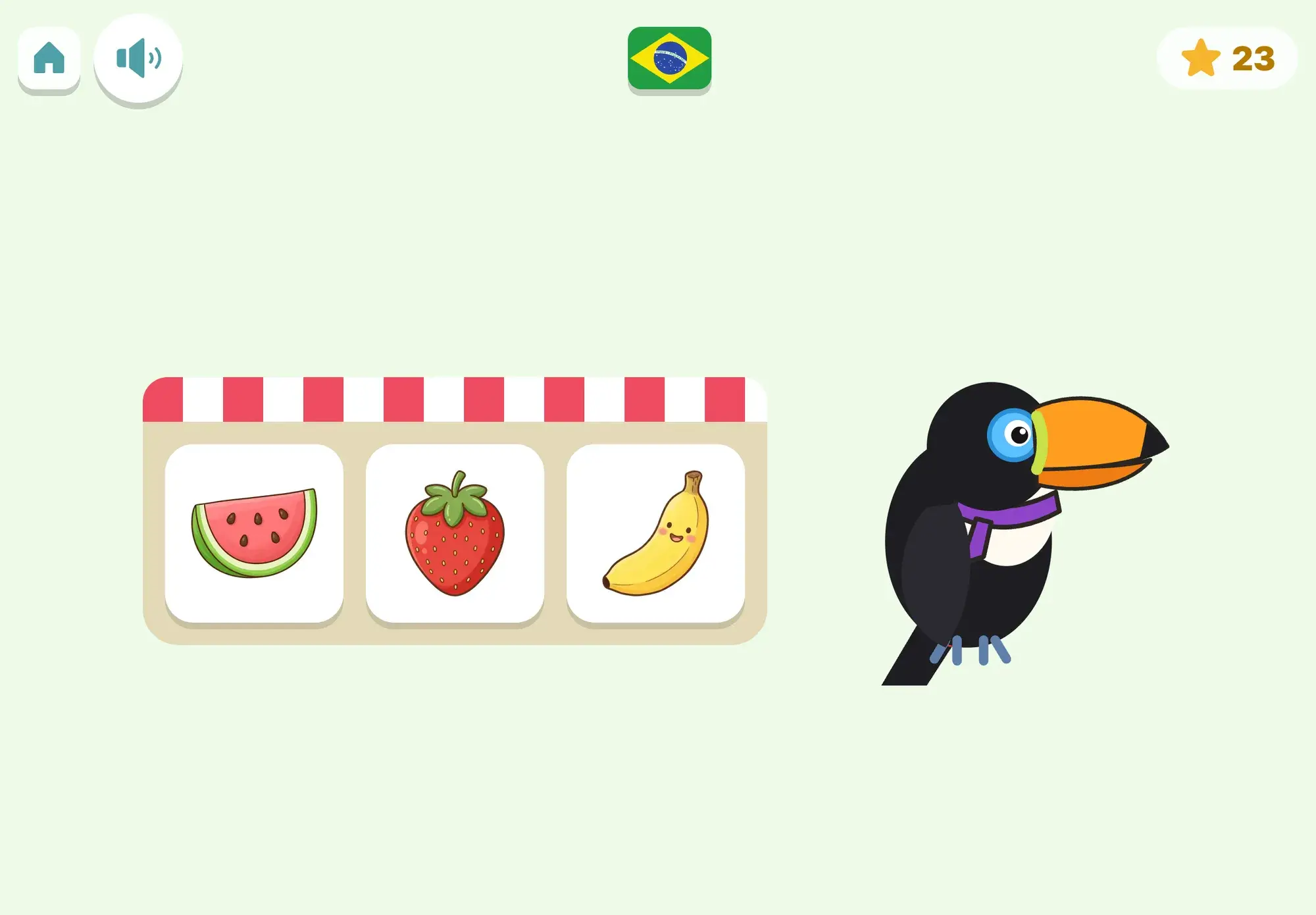 Tuca the toucan stands beside a fruit stall with a watermelon, a strawberry and a banana, waiting for the child to pick the one asked for in Portuguese